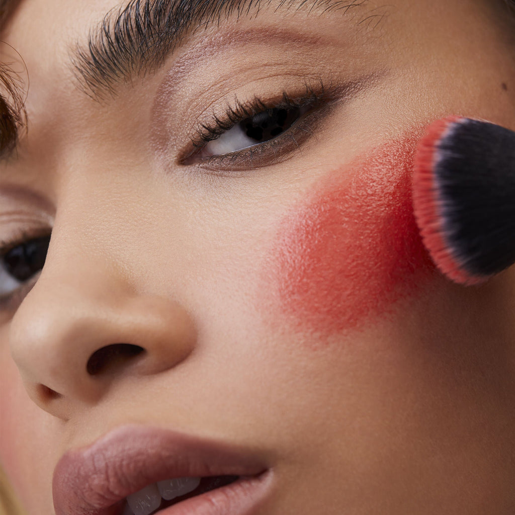 Applying Brush on Cheek